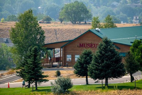 The Museum at the Bighorns, nestled among verdant trees, a must-visit for history buffs and a top thing to do in Sheridan, Wyoming.