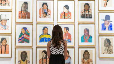 Girl looking at Paintings Brinton Museum