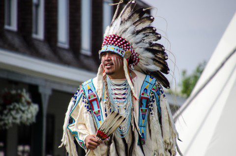 Native American chief in full regalia at a powwow near the Historic Sheridan Inn.