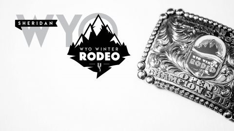 A black-and-white photo of a belt buckle with the logo of the Sheridan WYO Winter Rodeo on a white background for Skijoring Sheridan in Wyoming.