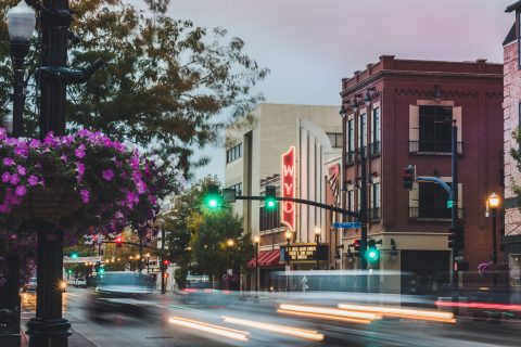 Evening lights streak by the WYO Theater in downtown Sheridan, a cultural centerpiece and top thing to do for visitor s and locals.